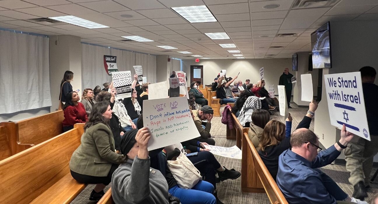 A crowd of people both for and against the Minneapolis City Council's ceasefire resolution at the Jan. 25 Minneapolis City Council meeting.