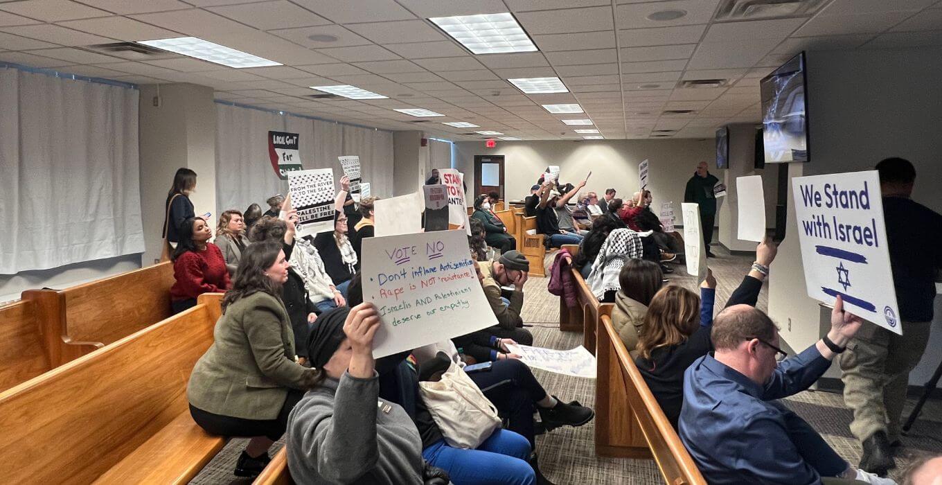 A crowd of people both for and against the Minneapolis City Council's ceasefire resolution at the Jan. 25 Minneapolis City Council meeting.