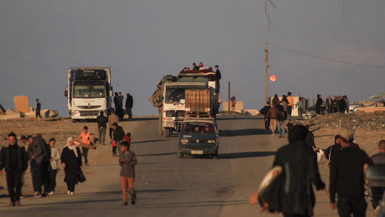 Residents in vehicles head towards southern Gaza, following Israeli evacuation orders, on the coastal sea route in central Gaza, on Thursday, Jan. 4, 2024. 