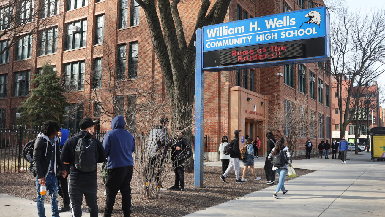 Students leave William Wells High School, part of Chicago Public Schools, March 14, 2022, in Chicago Illinois. CPS is the subject of a new federal Title VI discrimination investigation with the Department of Education. (Scott Olson/Getty Images)