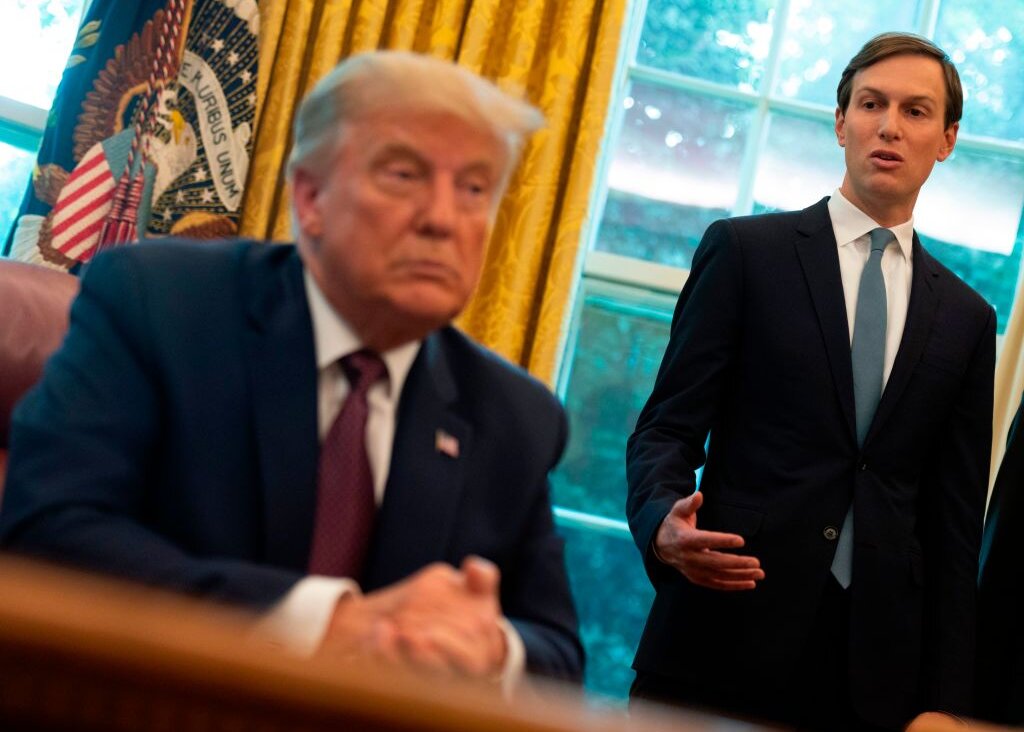 Former President Donald Trump listens to Jared Kushner in the Oval Office on Sept. 11, 2020. 