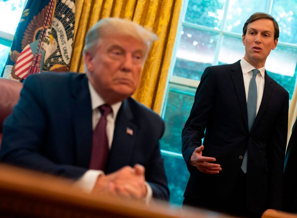 Former President Donald Trump listens to Jared Kushner in the Oval Office on Sept. 11, 2020. 