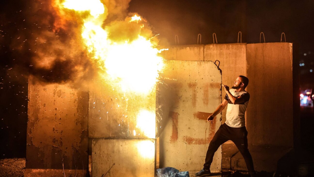 A Palestinian demonstrator during confrontations with Israeli security forces  at the Israeli Hawara checkpoint near the West Bank town of Nablus following a rally in support of Palestinian prisoners held in Israeli jails, on September 8, 2021.