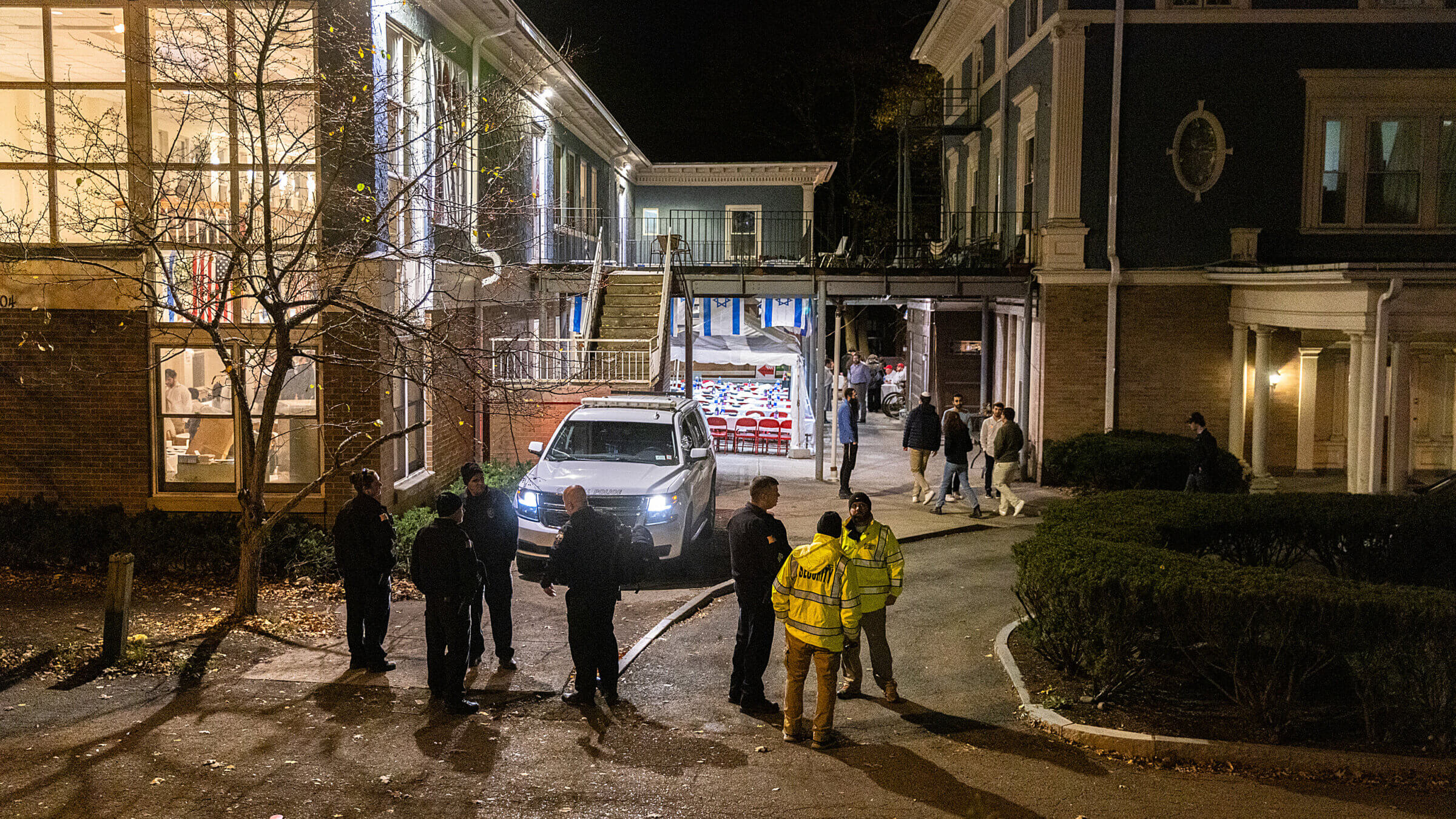 Police and security stand outside the Center for Jewish Living at Cornell University in early November, after a student made violent antisemitic threats. Despite reporting experiencing higher rates of antisemitism, younger Jewish adults were less likely to say that it was a "very" serious problem.