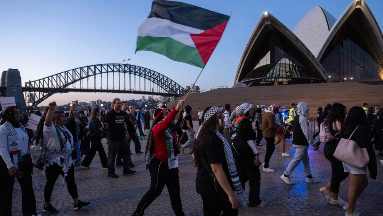 Pro-Palestinian protesters rally in front of the Opera House in Sydney, Oct. 9, 2023. (Louie Douvis / The Sydney Morning Herald via Getty Images)