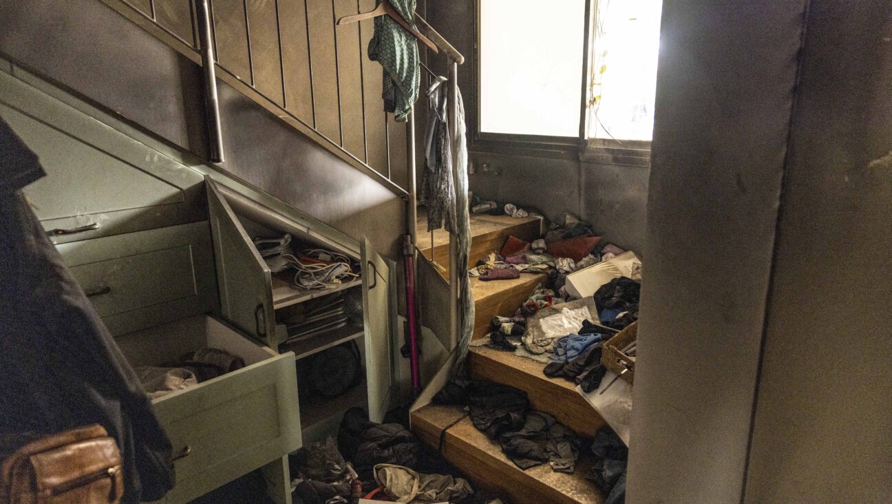 Damage is seen inside a house at Kibbutz Be'eri.