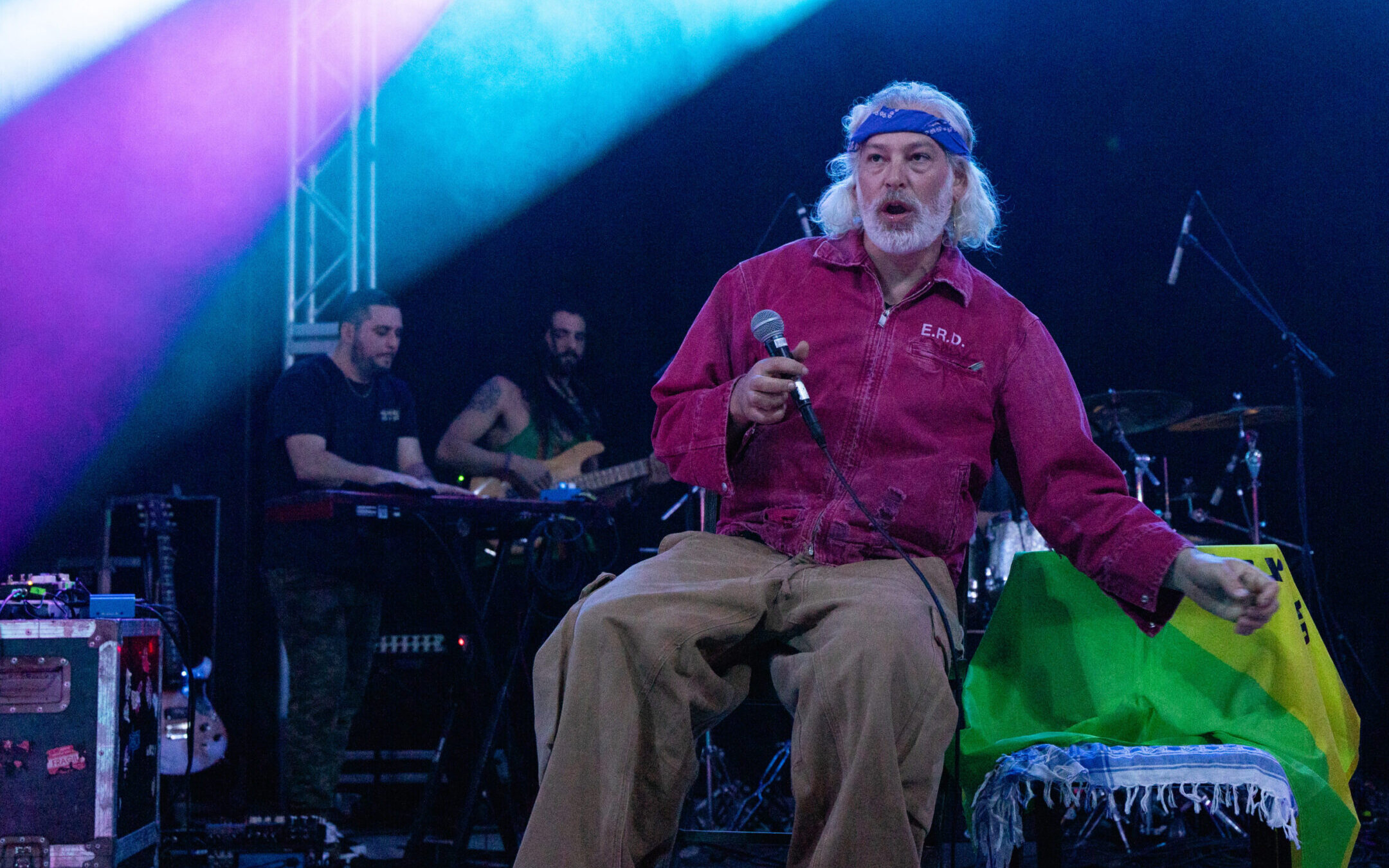 Matisyahu performs in concert during the “Hold The Fire Tour” at Stubb’s Waller Creek Amphitheater in Austin, Texas, Feb. 10, 2024. An Israeli flag and a flag of an Israeli army unit, Golani, are visible on the chair next to him. (Rick Kern/Getty Images)