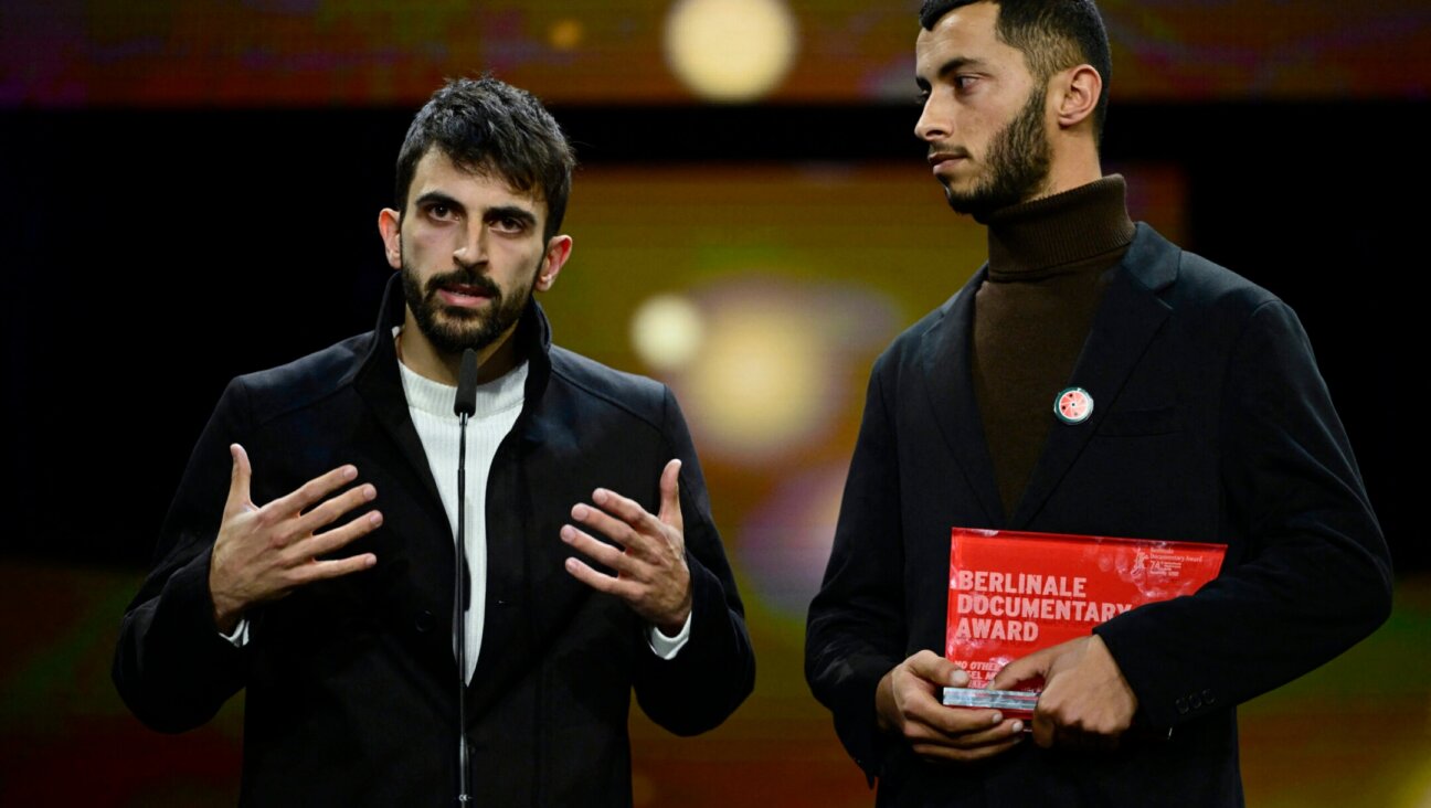 Israeli director Yuval Abraham (L) and Palestinian director Basel Adra speak on stage after having received the Berlinale documentary award for “No Other Land” during the awards ceremony of the 74th Berlinale International Film Festival, Feb. 24, 2024 in Berlin. (John MacDougall/AFP via Getty Images)