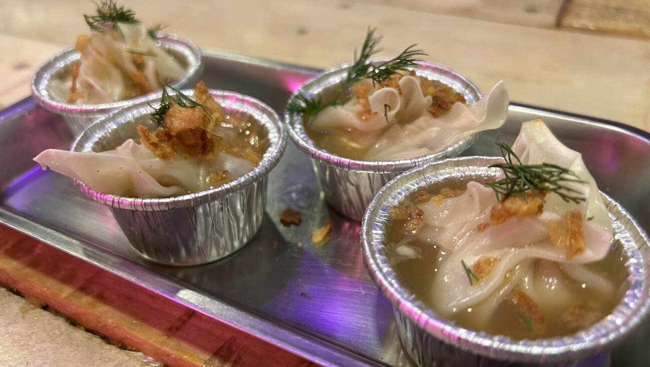 Lucky Rabbit's matzo ball soup dumplings are boiled and served in an Asian-style chicken stock that contains ginger, vinegar, and Chinese five spice powder.