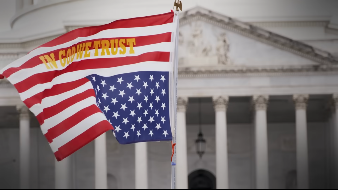 In “God and Country,” a documentary produced by Rob Reiner, footage from real events showcases the signs and symbols of growing Christian nationalism in the United States. (Screenshot)