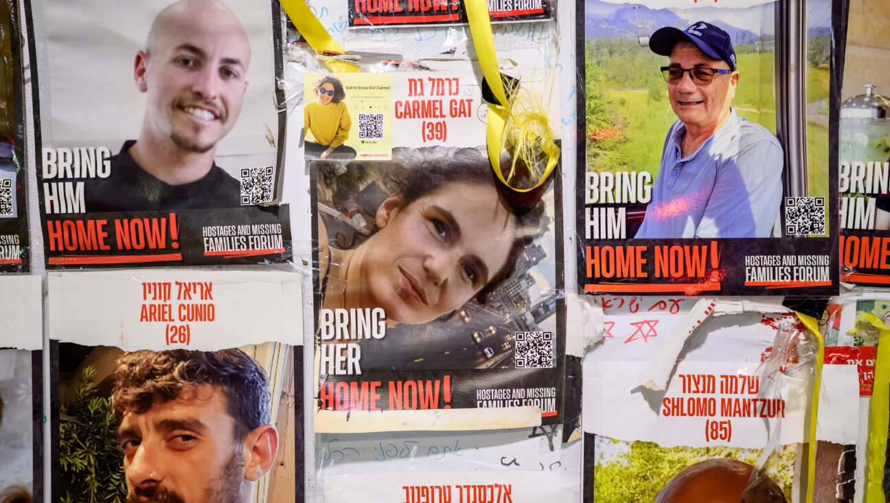 Posters of Hamas hostages on a wall at Hostage Square in Tel Aviv.