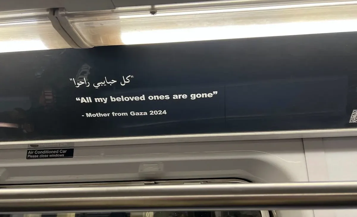 Artists protesting the war in Gaza replaced ads on a New York City subway train with posters like this.