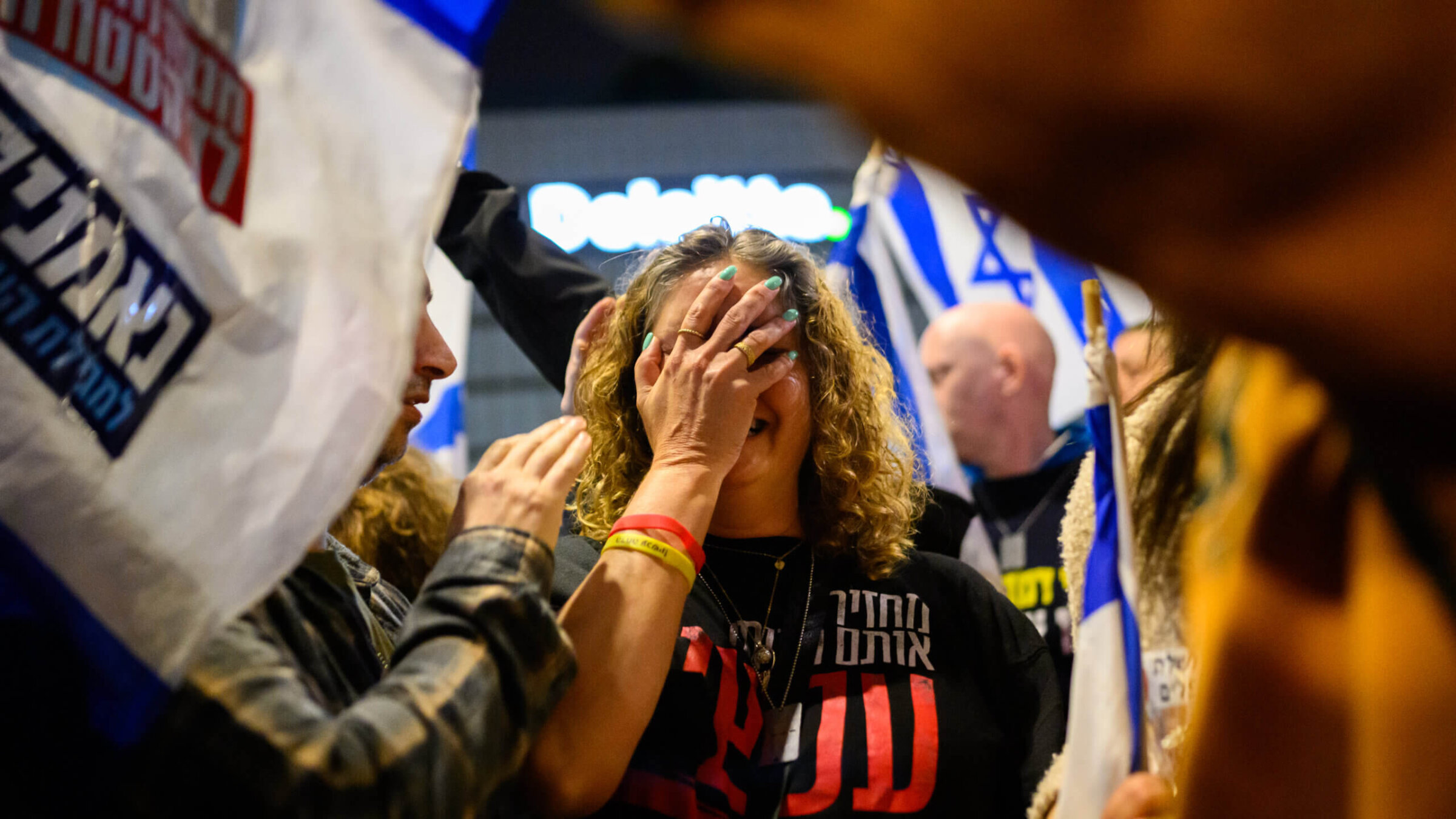 A woman calling for the release of hostages cries after being caught in a clash between demonstrators and police during a recent protest for the release of hostages and against the Israeli government and Prime Minister Benjamin Netanyahu.