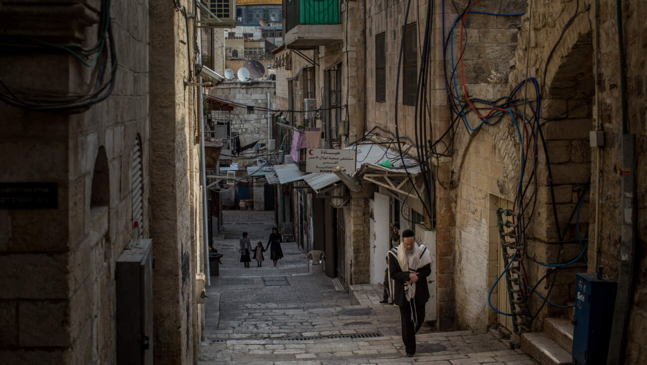 A Jewish man walks through Jerusalem's Old City. 