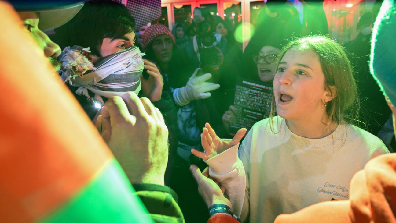 Students and other protesters argue near Columbia University in February. The Anti-Defamation League's new "report cards" for colleges and universities drew a rebuke from many Hillel leaders.