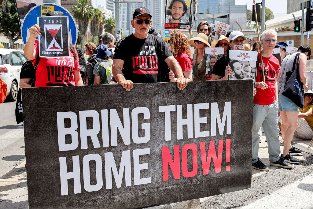 Friends and family of the Israeli hostages held in Gaza protest outside the Defense Ministry headquarters in Tel Aviv on April 25.