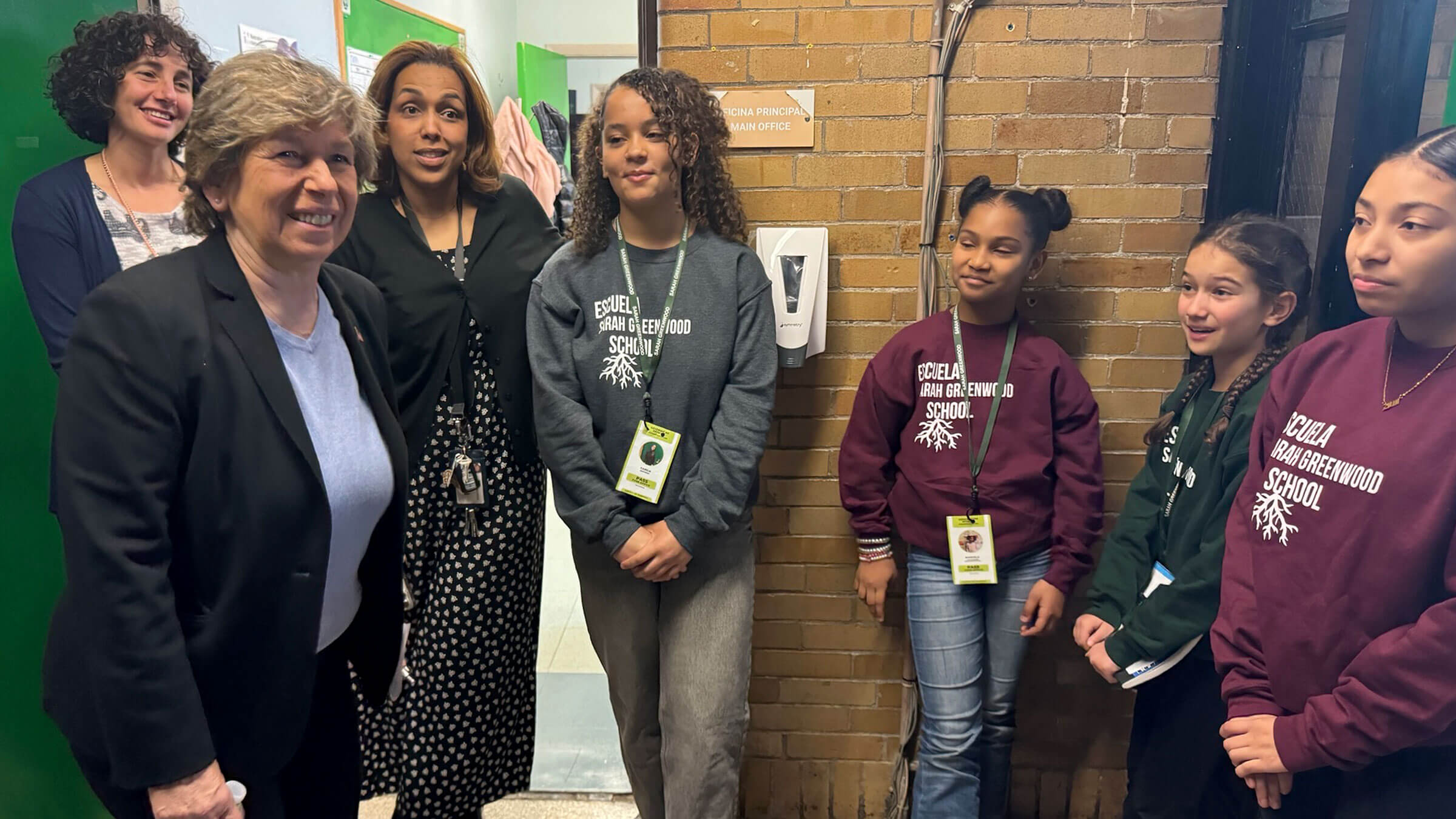 Weingarten, left, with student leaders and staff at Sarah Greenwood School in Boston
on April 11.