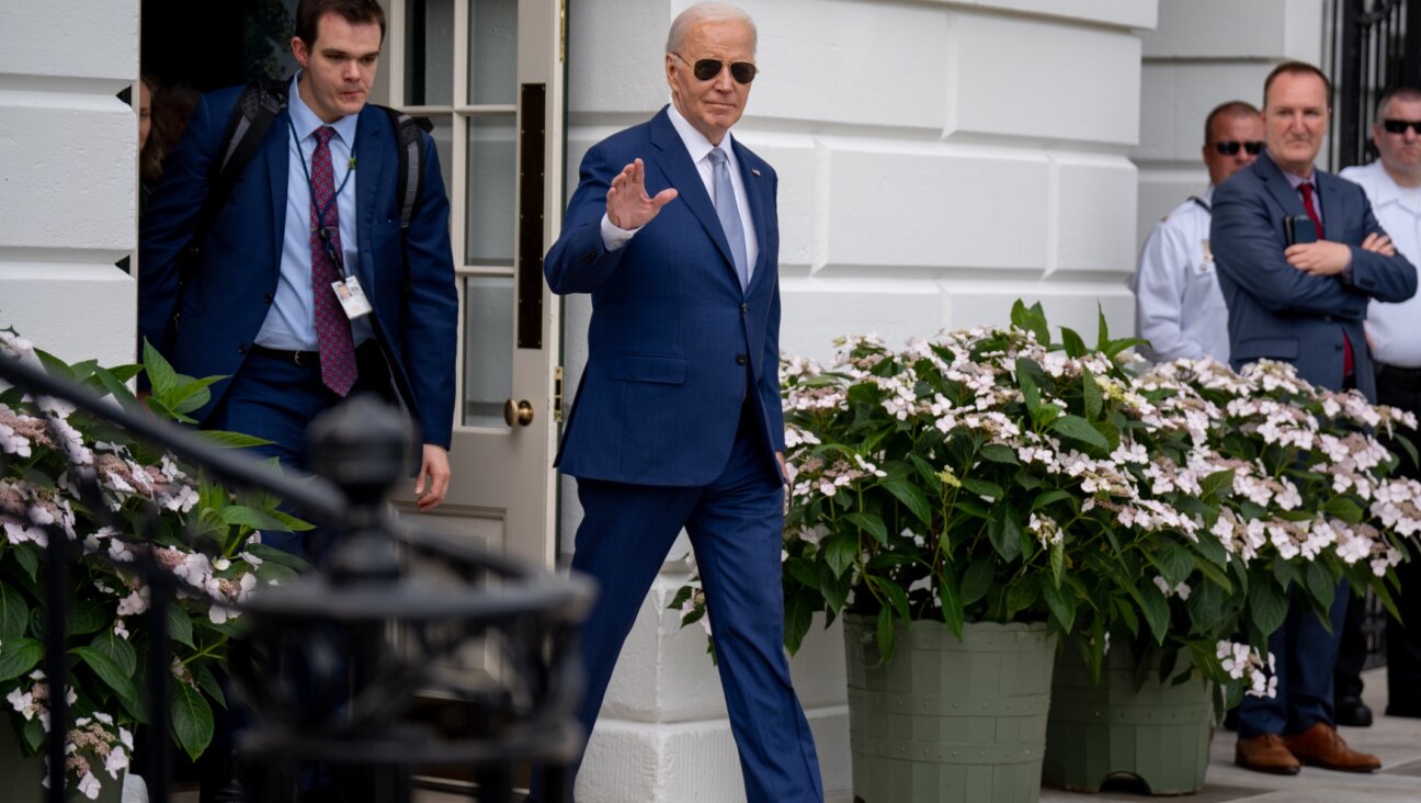 President Joe Biden, accompanied by aide Jacob Spreyer, waves to members of the media as he walks towards Marine One on the South Lawn of the White House, May 9, 2024. (Andrew Harnik/Getty Images)