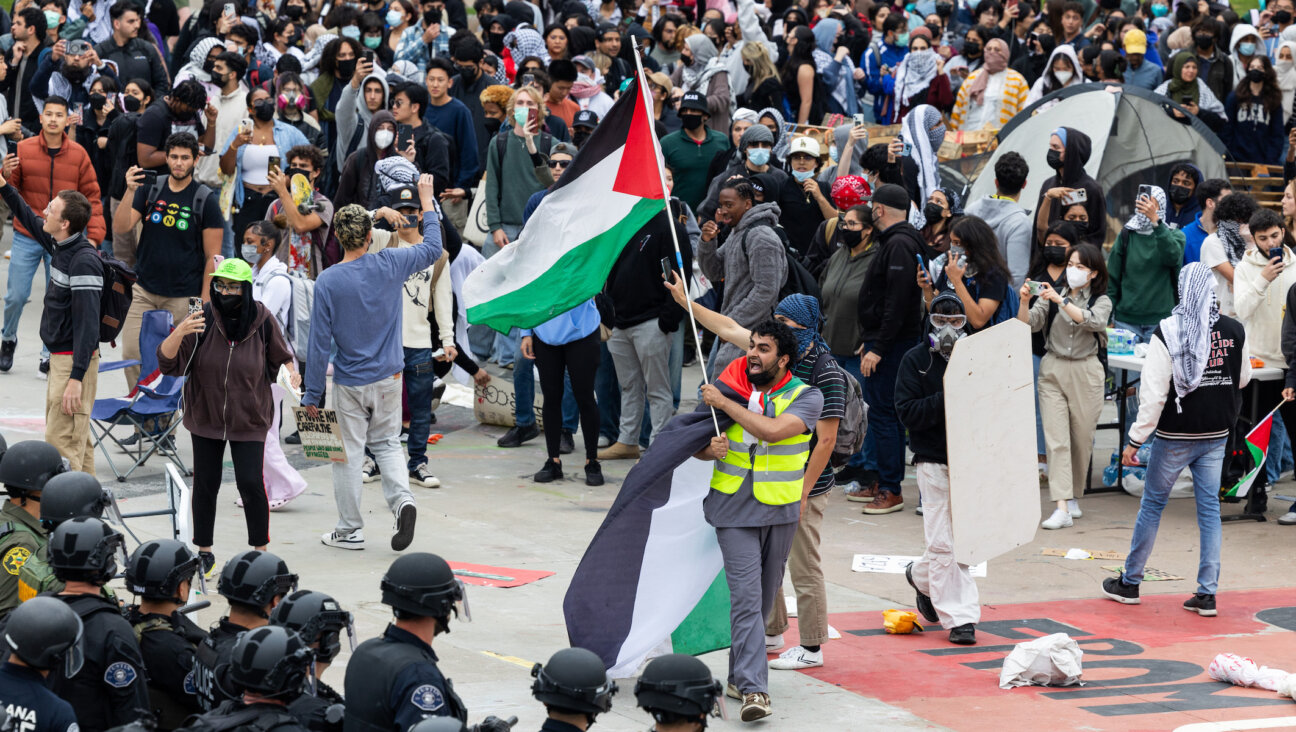 Police officers clash with pro-Palestinian demonstrators at the University of California at Irvine (UCI) on May 15, 2024 in Irvine, California. (Qian Weizhong/VCG via Getty Images)