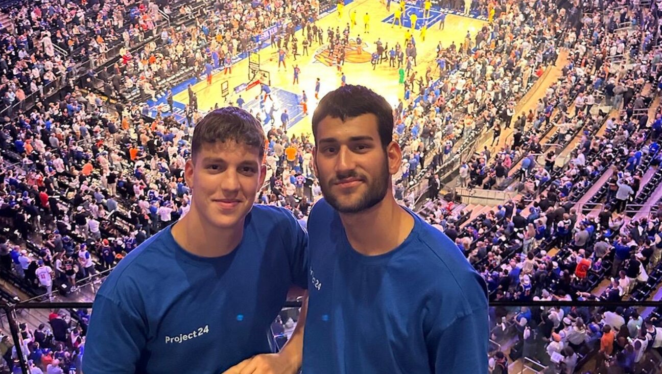 Beinart, left, and Moses Auerbac, right, at Madison Square Garden on May 19. (Courtesy Guy Moses Auerbac)