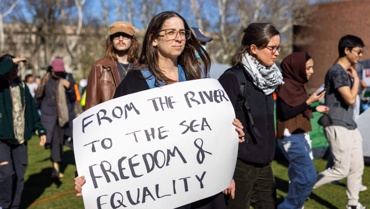 Students from Harvard University and the Massachusetts of Technology rally at a protest encampment by The Scientists Against Genocide at MIT on April 22. 