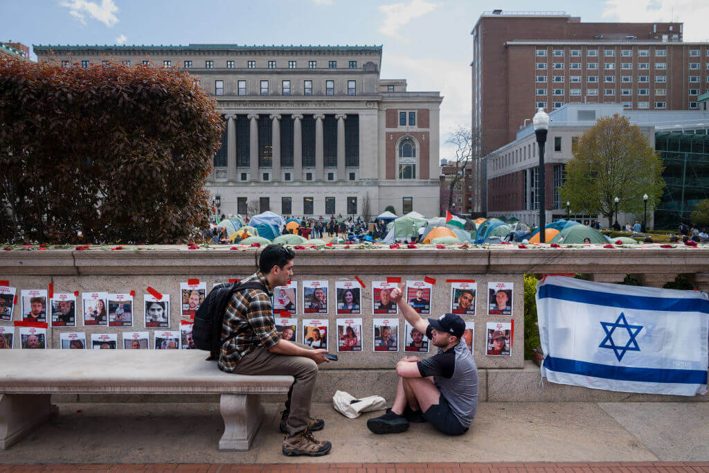 An Israeli flag and photos of the hostages placed opposite the encampment of pro-Palestinian student protesters at Columbia University.
