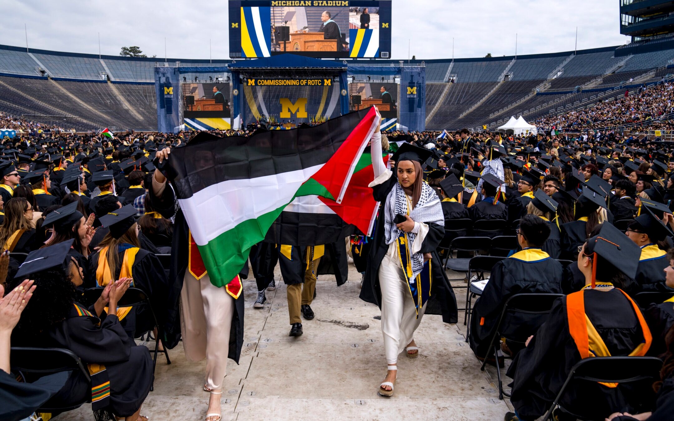 Salma Hamamy carries a Palestinian flag during a pro-Palestinian protest during the University of Michigan’s commencement ceremony on May 4, 2024 at Michigan Stadium in Ann Arbor, Michigan. (Nic Antaya/Getty Images)