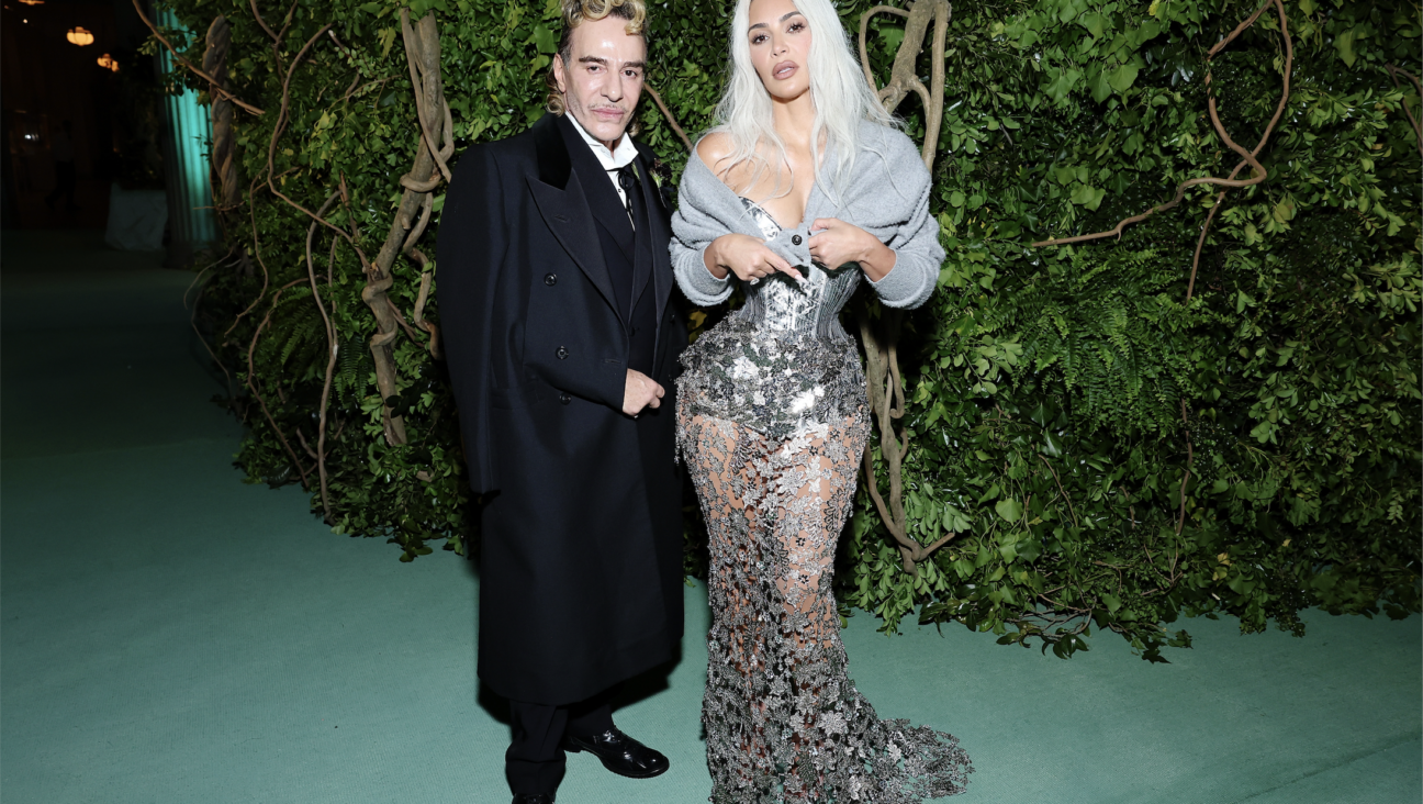 Kim Kardashian and John Galliano, who designed her dress.