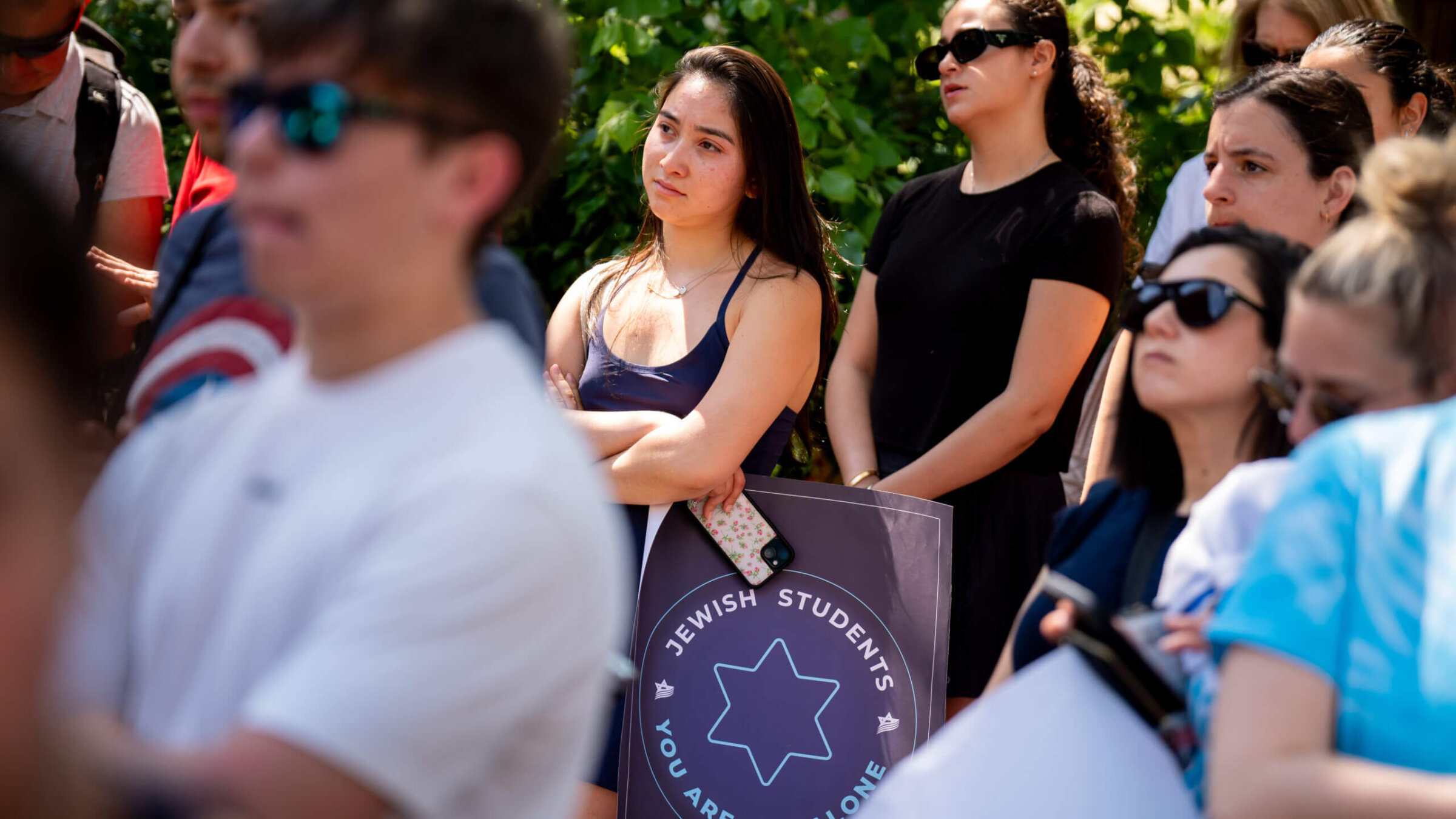 A woman holds a sign that reads "Jewish Students You Are Not Alone" during a rally against campus antisemitism at George Washington University on May 2, 2024 in Washington, DC. 