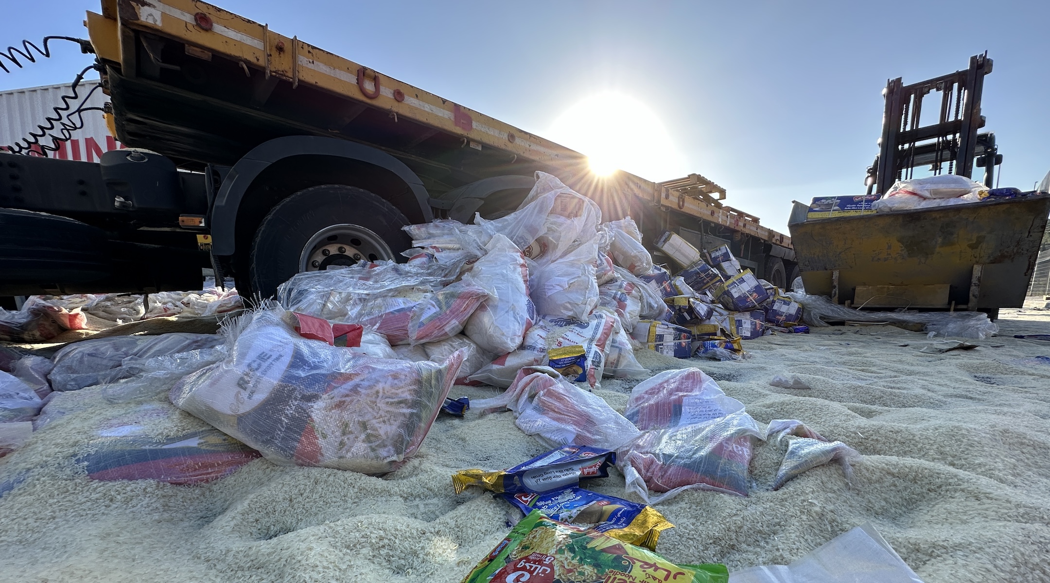 TARQUMIYAH, WEST BANK – MAY 13: Humanitarian aid supplies dumvped by Jewish settlers to road near Tarqumiyah military checkpoint in Hebron, West Bank on May 13, 2024. Jewish settlers stopped the trucks en route to Gaza Strip to help Palestinians in need, and dumped the supplies on the road. (Photo by Ibrahim Hamad/Anadolu via Getty Images)