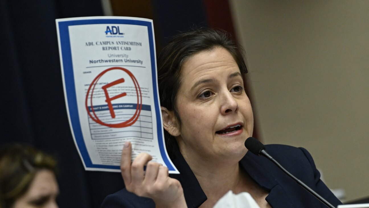 Rep. Elise Stefanik displays the Anti-Defamation League’s “F” campus report card grade for Northwestern as the presidents of that school, Rutgers, and UCLA testify on campus antisemitism, May 23, 2024.