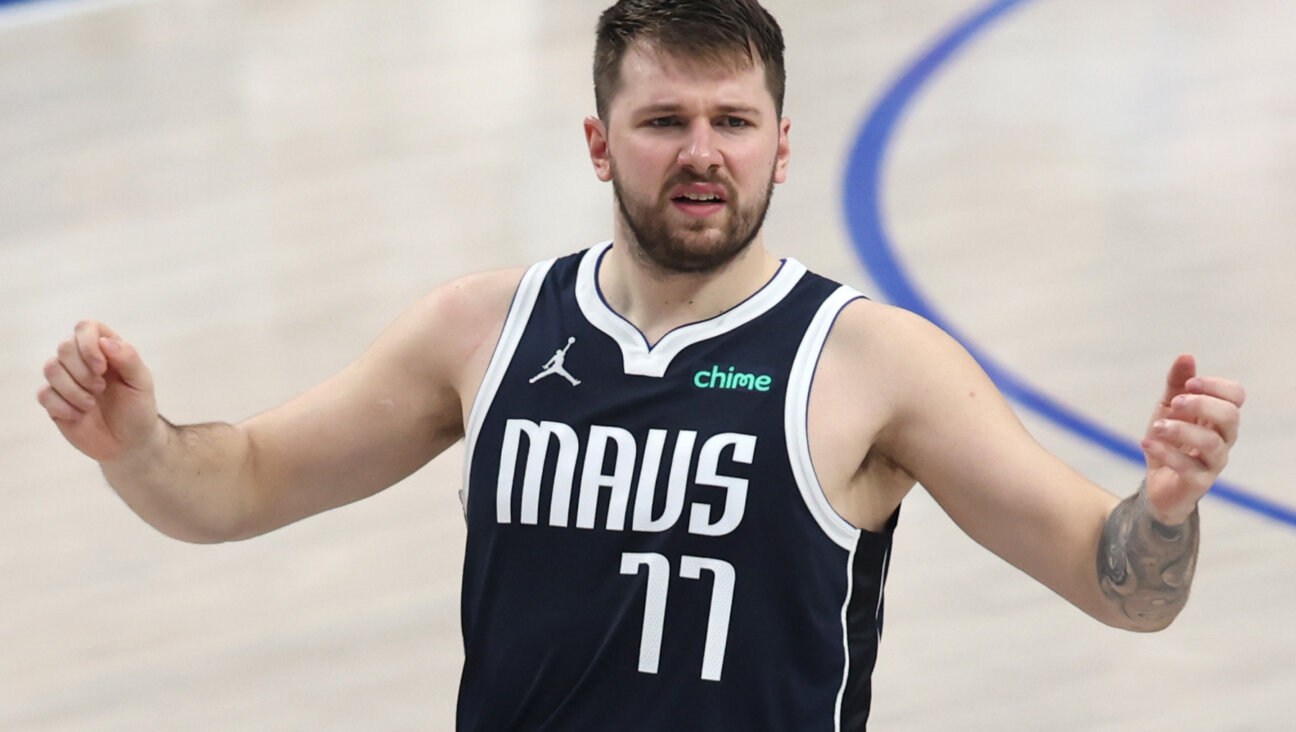 Luka Doncic #77 of the Dallas Mavericks reacts during the second quarter against the Minnesota Timberwolves in Game Four of the Western Conference Finals at American Airlines Center May 28 in Dallas, Texas.