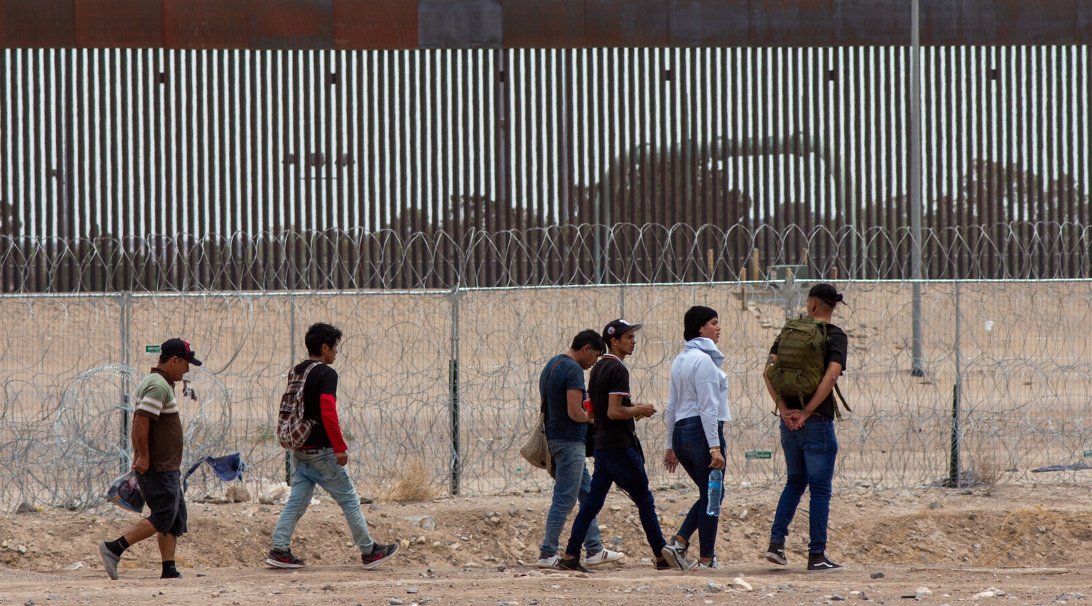 Migrants at the U.S.-Mexico border on the day President Joe Biden signed a new executive order restricting entry for asylum seekers, June 4, 2024, in Ciudad Juarez, Mexico. (David Peinado/Anadolu via Getty Images)