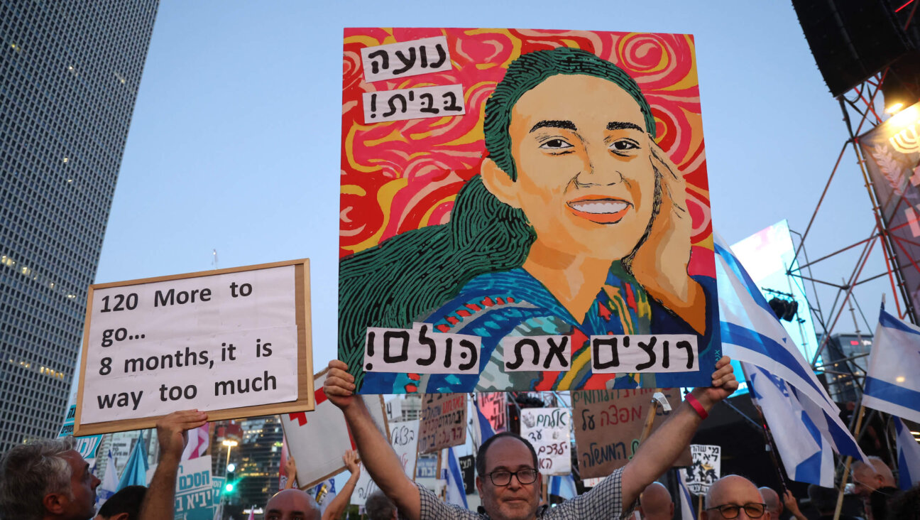 A poster depicting Noa Argamani, one of four Israeli hostages rescued by the Israeli army, was held up as Israeli activists rallied on Saturday. 