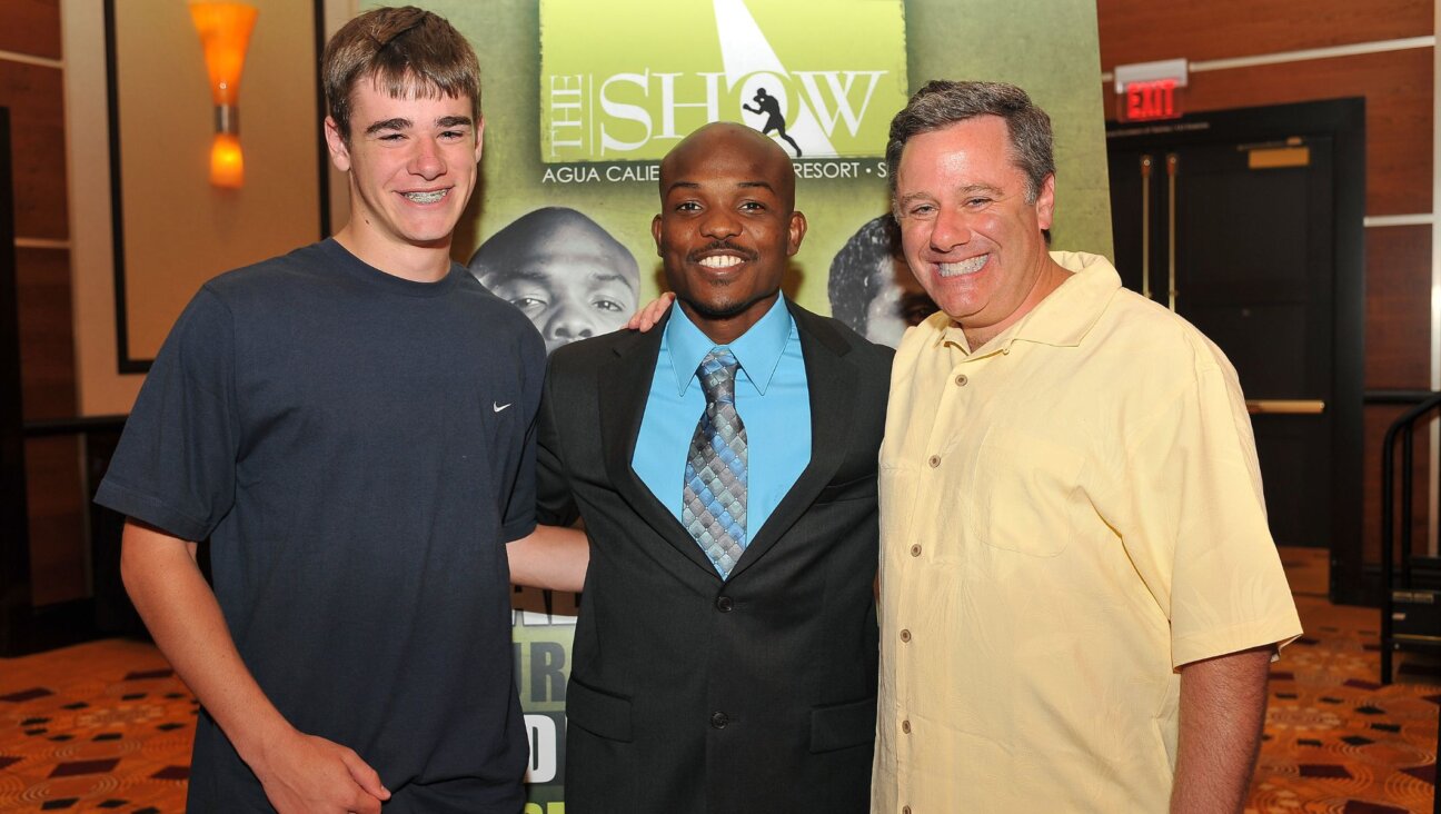 Fred Sternburg, right, with his son David, left, and two-division world champion Timothy Bradley. (Courtesy of Fred Sternburg)