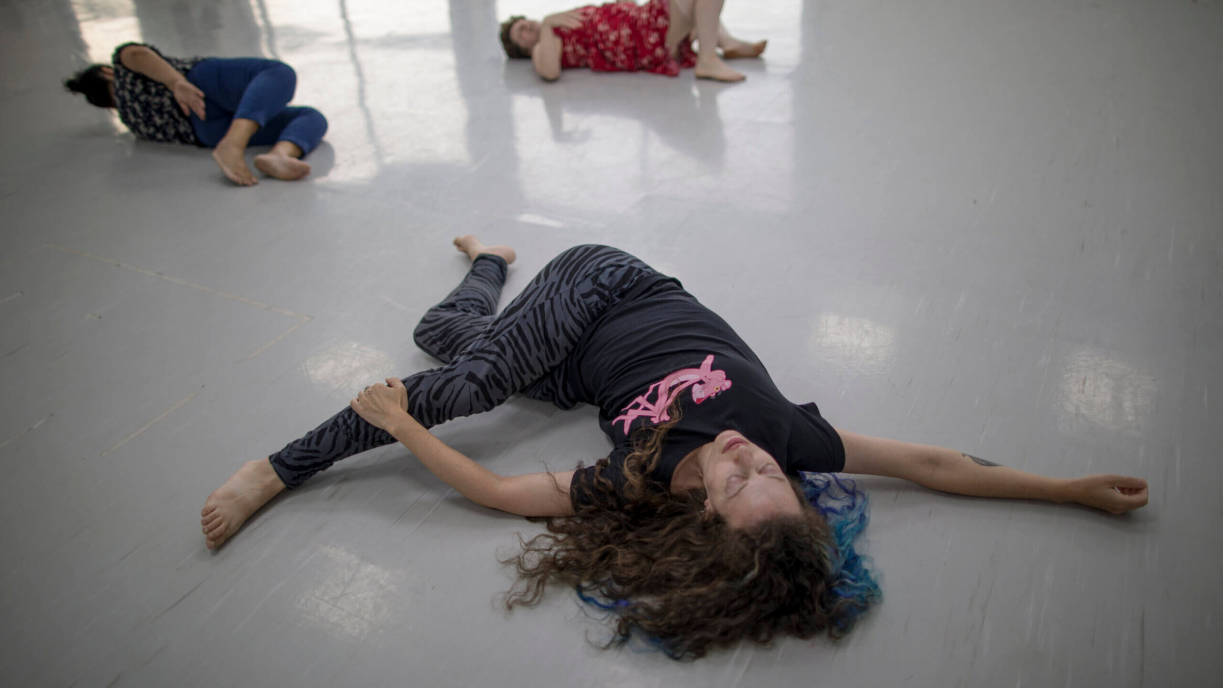 Members of the Rana Choir stretch before a rehearsal Tuesday evening in Jaffa.