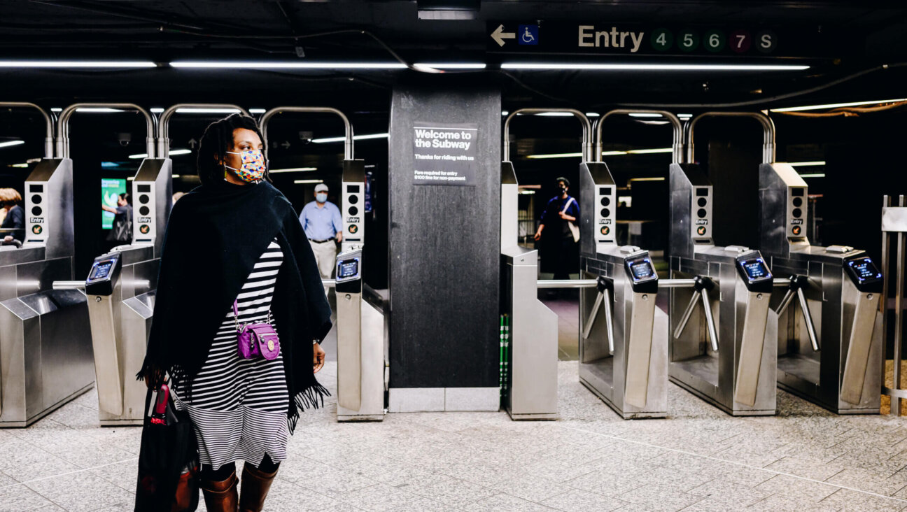 People wearing protective masks exit the subway station at Grand Central in New York City June 14, 2021.