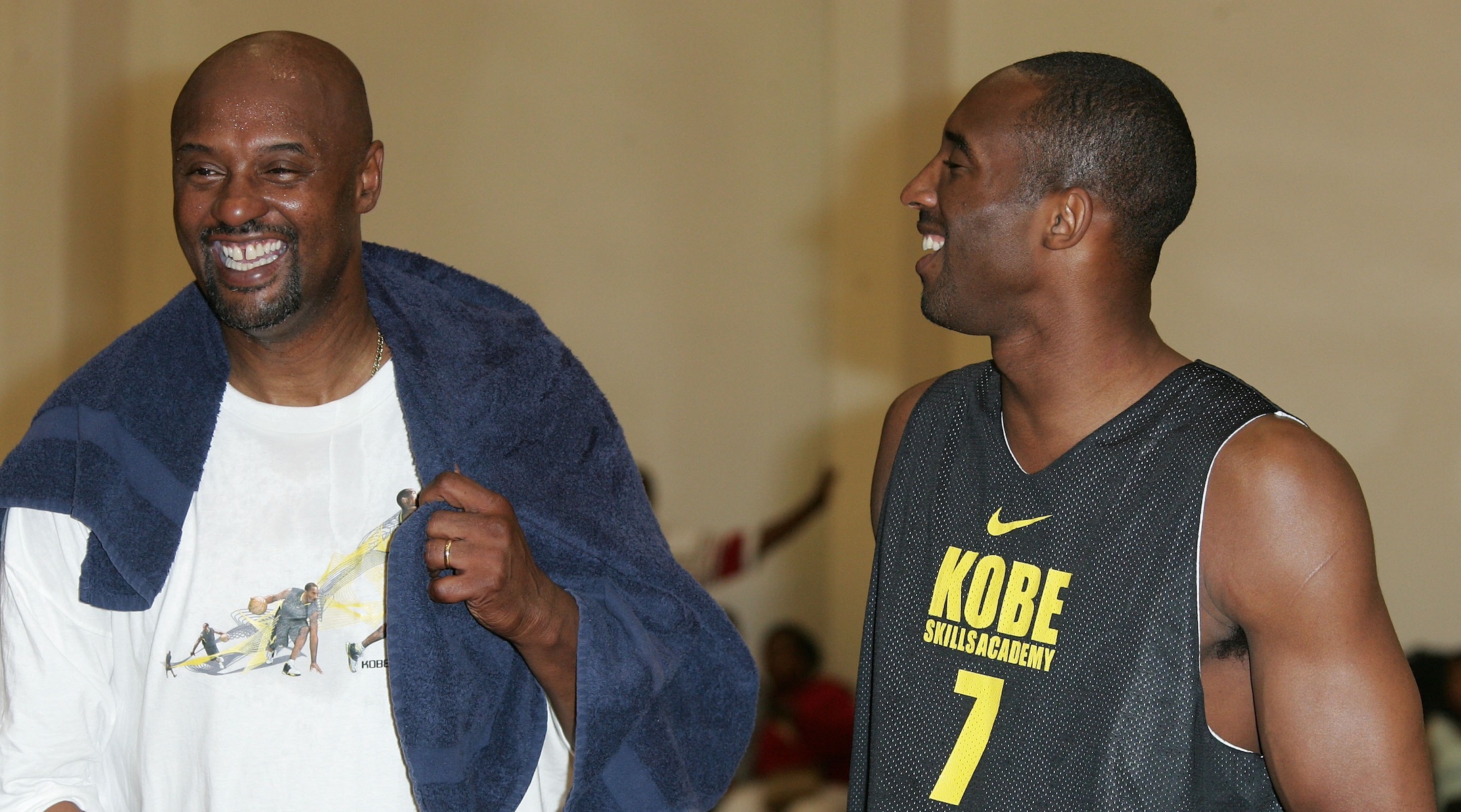 Joe Bryant, left and his son Kobe share a laugh at the Kobe Basketball Academy at Loyola Marymount University on July 5, 2007 in Los Angeles, California. (Noel Vasquez/Getty Images)