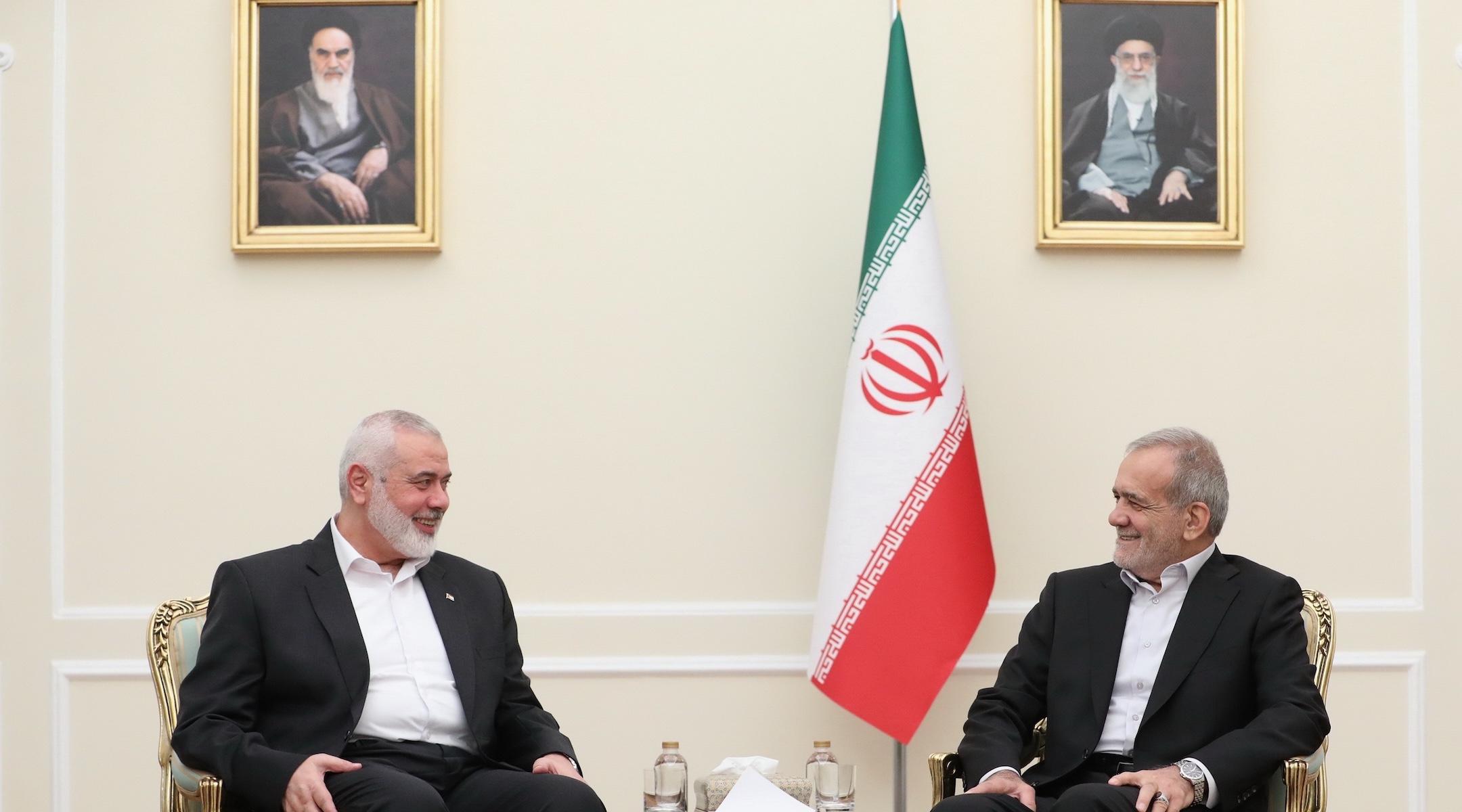 Iranian newly-elected President Masoud Pezeshkian, right, meets Head of the Palestinian Hamas group’s political bureau Ismail Haniyeh, left in Tehran, Iran on July 30, 2024. (Iranian Presidency / Handout/Anadolu via Getty Images)