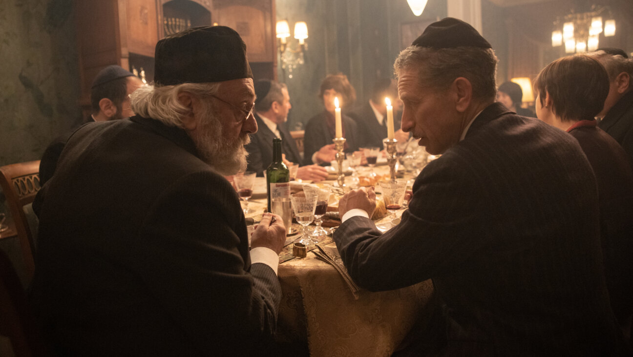 Avrum Goldstein (Mark Ivanir) and Jakob Grün (Moisej Bazijan) have Shabbat dinner in season four of <i>Babylon Berlin.</i>
