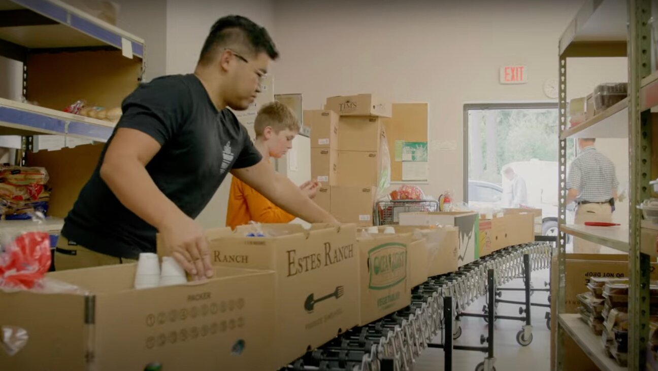 Volunteers at the Oregon Food Bank, 2023. (Screenshot via YouTube)