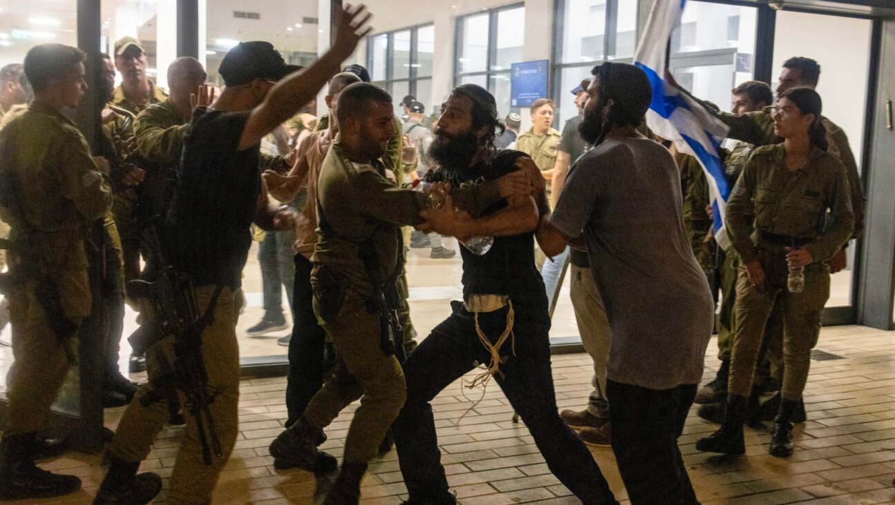 Israeli soldiers and police clash with right-wing protesters after they broke into the Beit Lid army base over the detention for questioning of military reservists who are suspected of abuse of a detainee, July 29, 2024. (Oren Ziv/AFP via Getty Images)