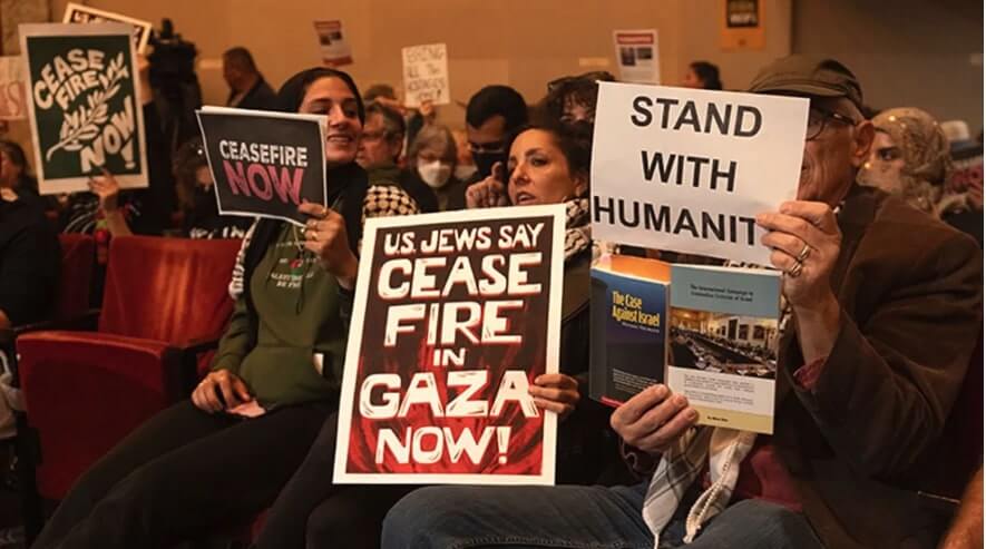 Supporters of a resolution calling for a ceasefire in Gaza at an Oakland City Council meeting, Nov. 27, 2023. 