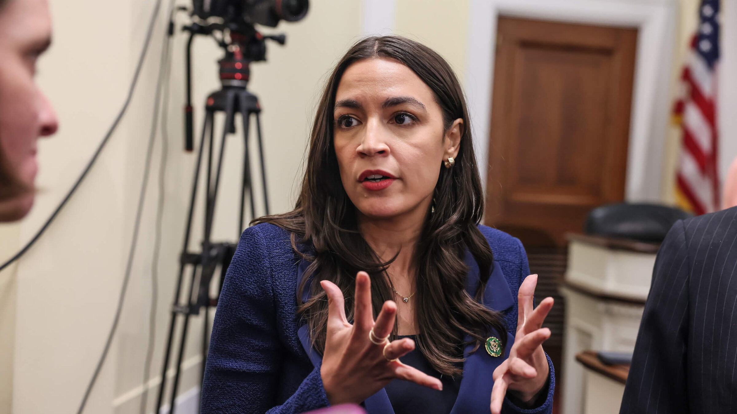 Rep. Alexandria Ocasio-Cortez speaks to journalists on Capitol Hill in June.