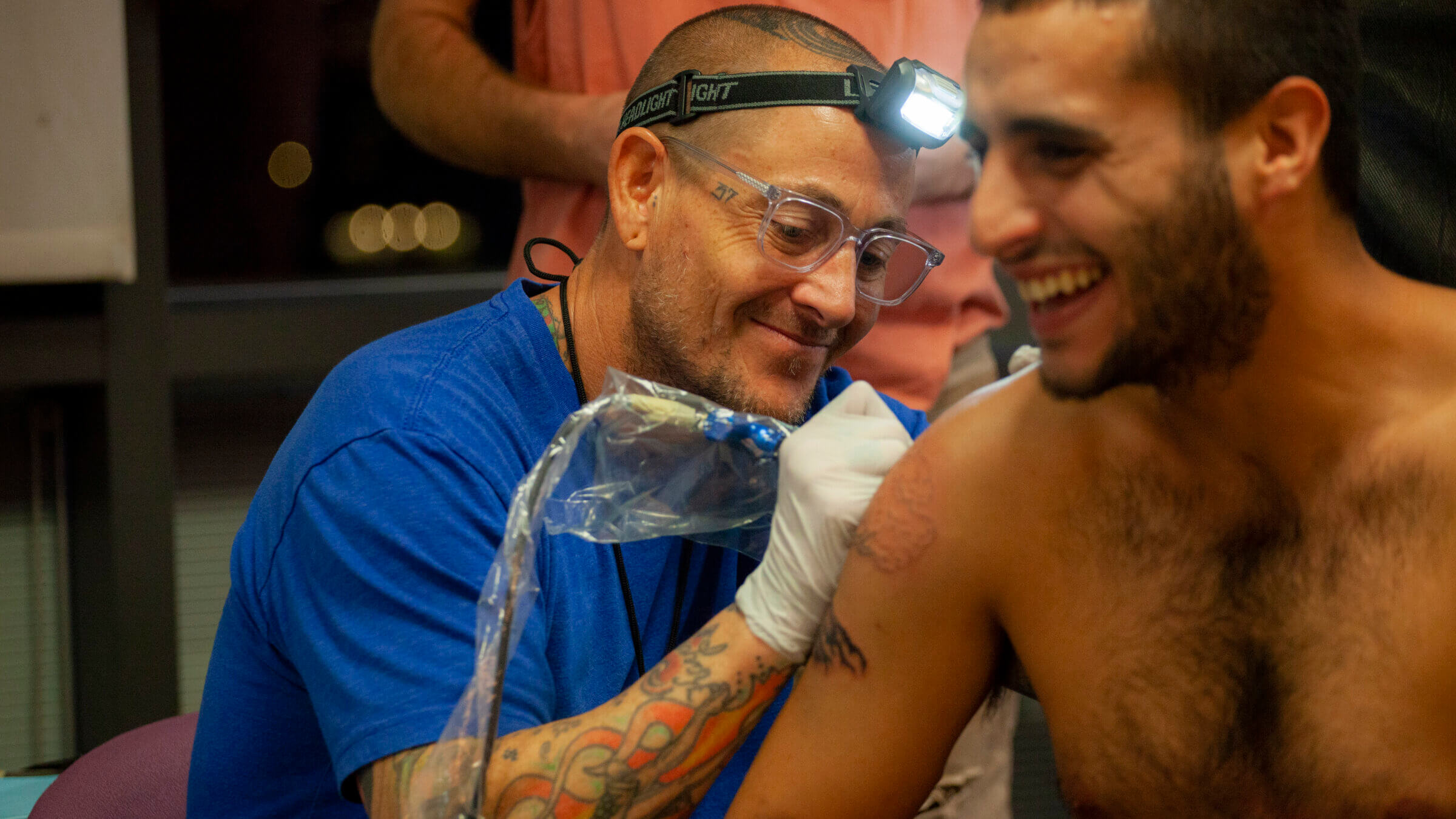 An artist who volunteers with HEALING INK, a project that gives free tattoos to victims of violence.