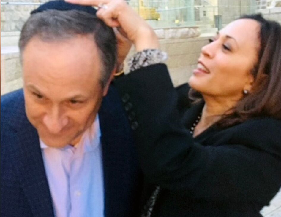 Kamala Harris affixes a kippah to the head of her husband, Doug Emhoff, as they visit the Western Wall, Jerusalem, November 2017. 