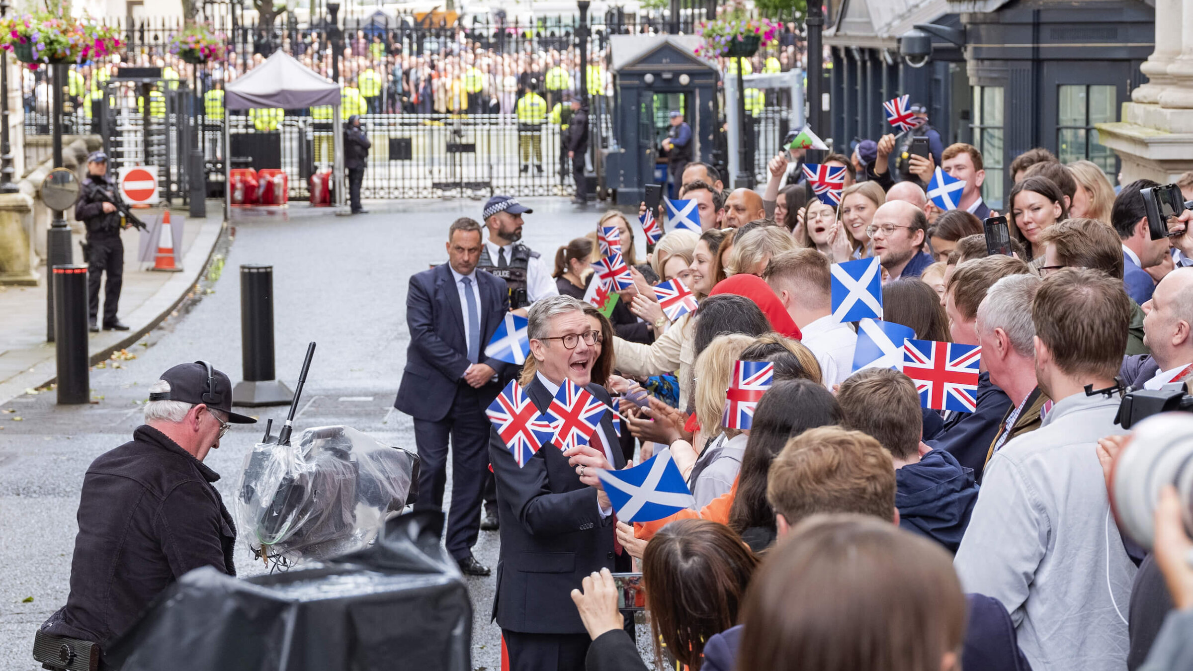 Newly elected UK Prime Minister Keir Starmer greets supporters at the prime minister's residence at 10 Downing Street in London. 