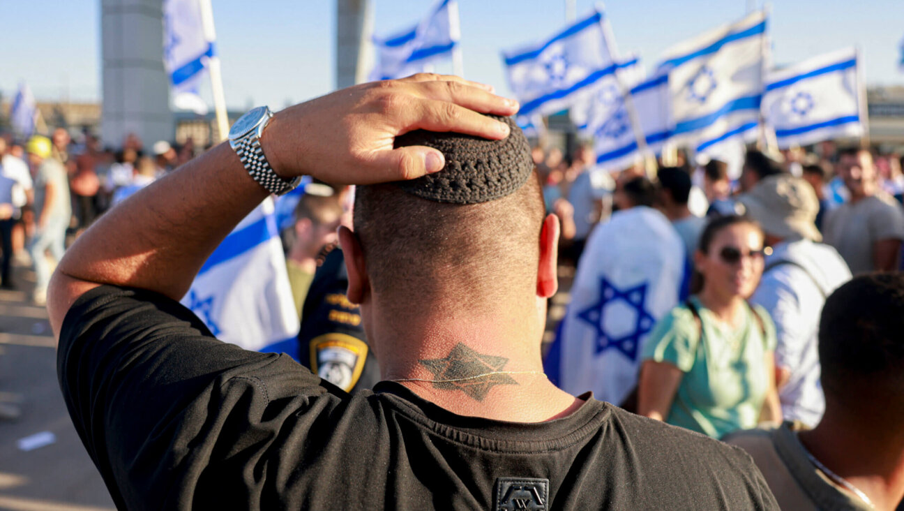 Right-wing Israelis demonstrate next to the Sde Teiman military base against the detention for questioning of military reservists who were suspected of sexual abuse of a Palestinian detainee.