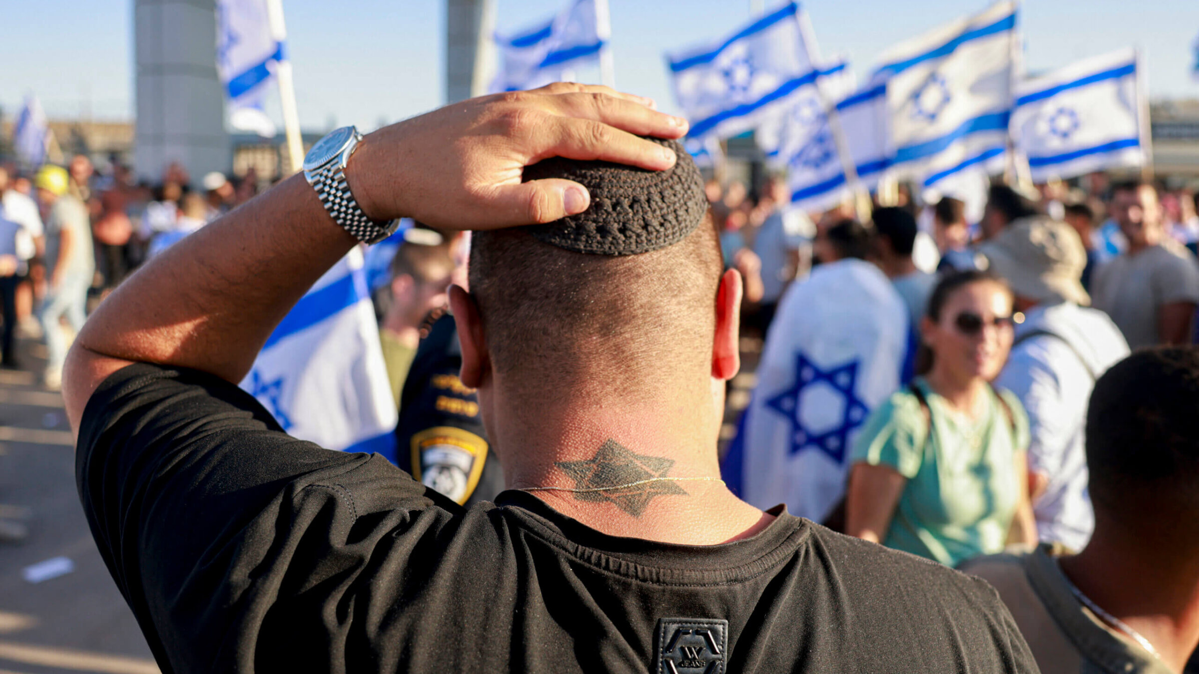 Right-wing Israelis demonstrate next to the Sde Teiman military base against the detention for questioning of military reservists who were suspected of sexual abuse of a Palestinian detainee.