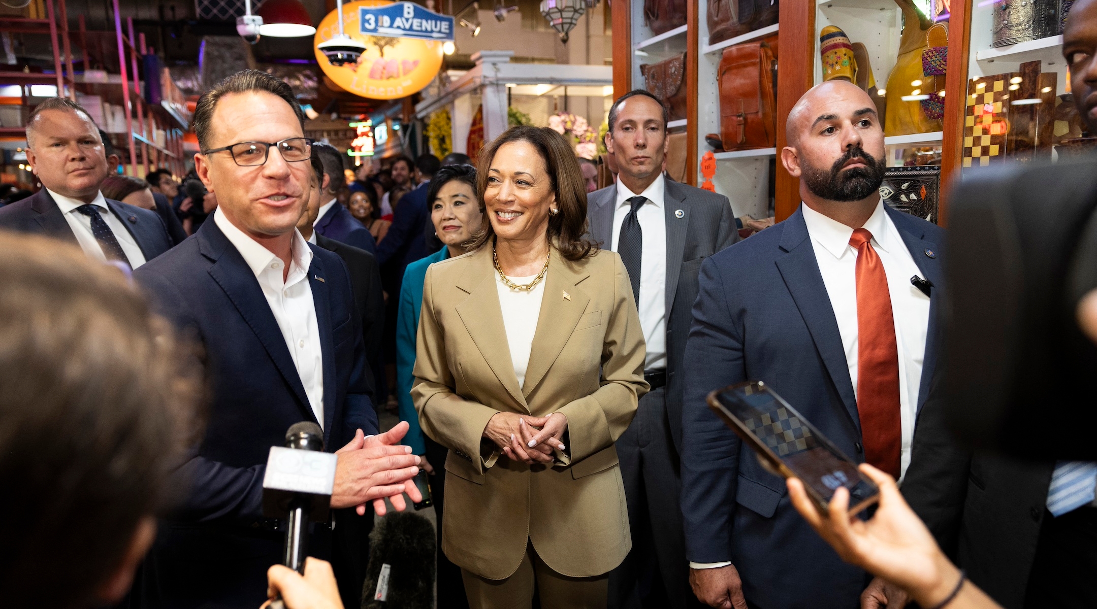 Vice President Kamala Harris and Pennsylvania Gov. Josh Shapiro, left, speak to the press while making a stop at the Reading Terminal Market in Philadelphia, Pennsylvania, July 13, 2024. (Ryan Collerd / AFP via Getty Images)